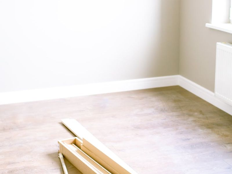 Quiet minimalist room with a wooden floor.